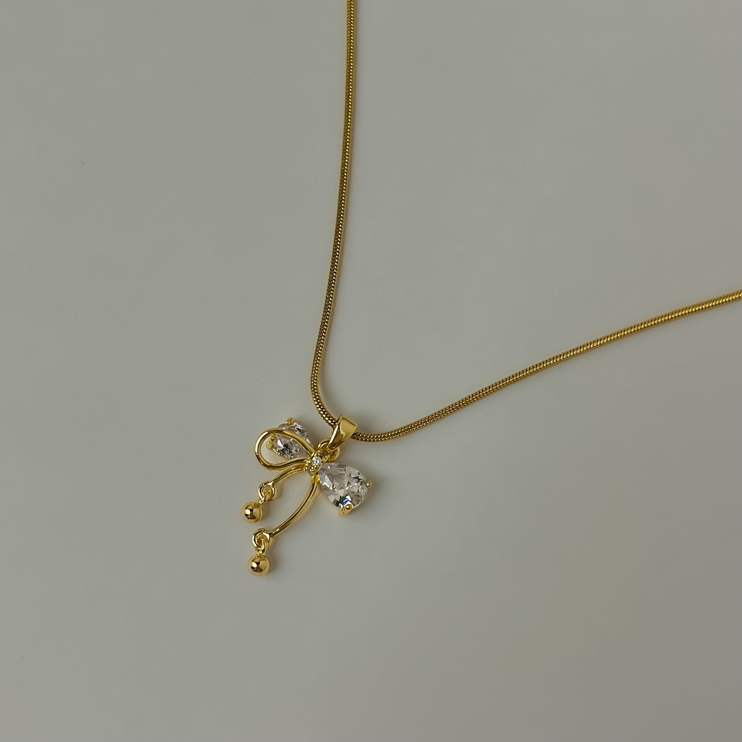 18K Gold Plated AD Stone Bow Sleek Necklace